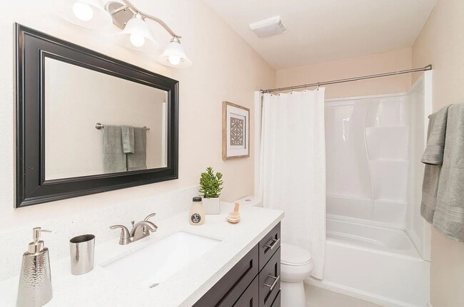 Photo - 4 Bedrooms and 2.5 baths!  Modern upgrades and a coastal community!