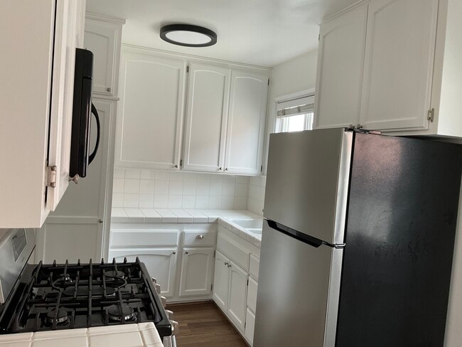 Kitchen with generous pantry and dine area - 702 S Pacific Coast Hwy Unit Apt. A