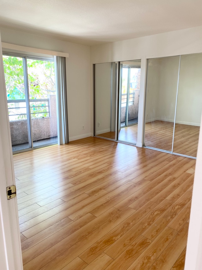 Master bedroom w/balcony and double closets - 158 N Normandie Ave Unit 201