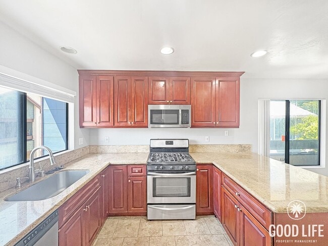 Photo - Light-Filled 2BD/2BA Top-Floor Condo in Mira Mesa with Granite Kitchen, Private Balcony & Pool