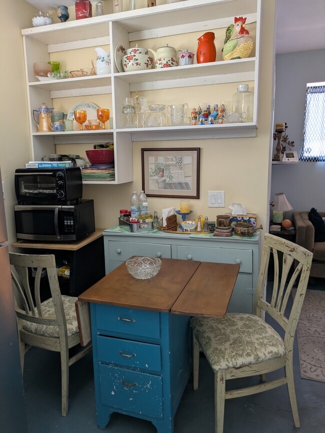 Kitchen has small table with flaps and fully stocked - 5041 Genesee Ave