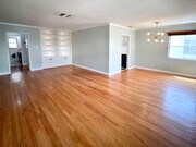 Living and dining areas. Built in bookshelf with recessed lighting. - 1327 N Central Ave Unit #F