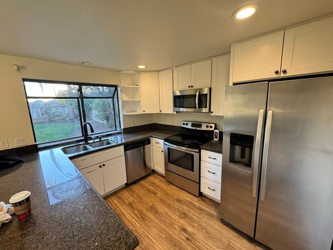 Photo - Elegant 4-Bed, 3-Bath Two-Story Home with Spacious Backyard and Private Downstairs Suite