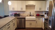 Quartz counters, stainless steel fridge/freezer, electric stove, dishwasher, plus microwave - 4944 Cass St Condo Unit 706