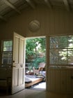 Living room looking onto front deck - 9612 National Blvd House