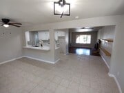 View from dinning room, looking toward kitchen and forma living room - 909 Galopago St