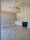 Large living room with all tiled floors. - 18681 Maplewood Cir Condo Unit 18681 Maplewood Circle