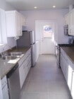 Kitchen and laundry room - 8017 Campion Dr