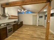 View from living room towards bedroom and front entry door - 3605 Helms Ave
