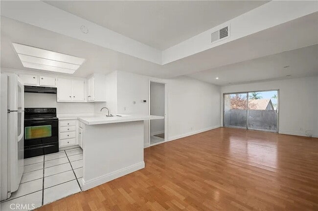 Photo - "Chic 1-Bed Retreat with Pool & Central Vacuum in Anaheim's Heart – 710 Sq Ft of Hardwood Elegance!"