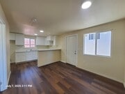 living room / kitchen - 1221 W 152nd St Apartments