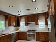 kitchen with new appliances - 15137 Gilmore St House