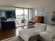 Living room with fireplace and balcony - 8530 Holloway Dr Condo Unit 426