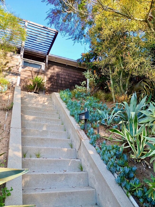 Building Photo - Hilltop Highland Park Sanctuary with Views, Private Gated Yard, In Unit Laundry, Parking & Abunda...