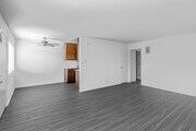 2BR, 1.5BA - 940SF - Living Room, Dining Room - The Bungalows Apartments
