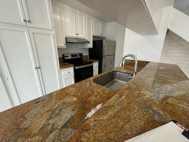 Photo - Two-Story 2 Bedroom, 1 Bath Lakeside Condo with Solar! Unit 2