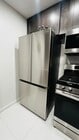 New kitchen With stainless steel refrigerator, dishwasher, microwave, and stove. Garbage disposal - 6600 Warner Ave Unit Modern Condo