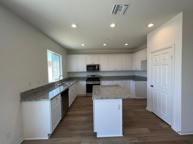 Photo - Newer 2022-Built, 4BR Home with Solar, Loft, Downstairs Bedroom, and Backyard