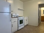 Kitchen looking thru laundry into bathroomkitchen - 532 Avenue C Apartments Unit 532.5