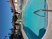 Inviting swimng pool and sun deck at Magnolia Apartments in Riverside, California. - Magnolia Apartments