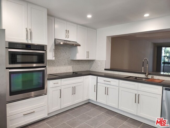 Building Photo - 2122 Century Park Ln Unit 213