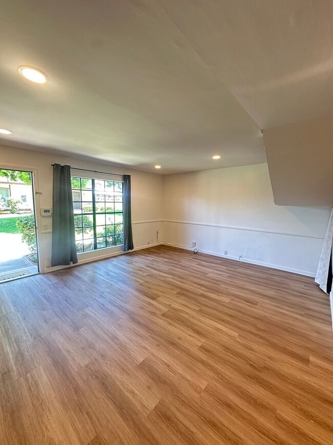 Photo - Spacious 3BR/2.5BA updated 2-story townhouse for rent with fenced patio, 2 parking spaces and more Unit A