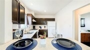 Kitchen w stove and fridge - 5853 Friends Ave Apartments Unit 3