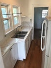 Kitchen w/ new cabinets and stove - 1011 1/2 N Coronado St Unit 1011 .5