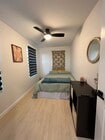Comfortable queen bed in second bedroom. - 2016 N Ave