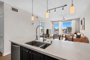 Kitchen, living, and dining area - AVA Balboa Park Apartments