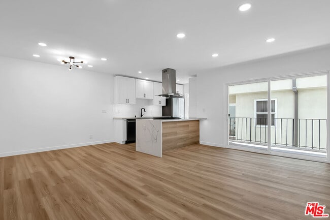 Building Photo - 1021 N Genesee Ave Unit 8