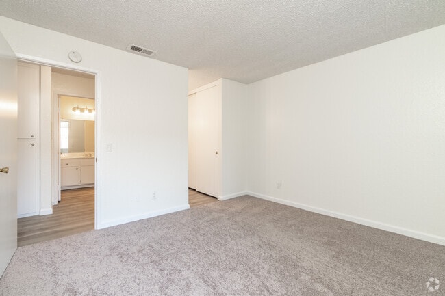 2BR, 1BA - 1025SF - Primary bedroom 1 - Cinnamon Creek Apartments