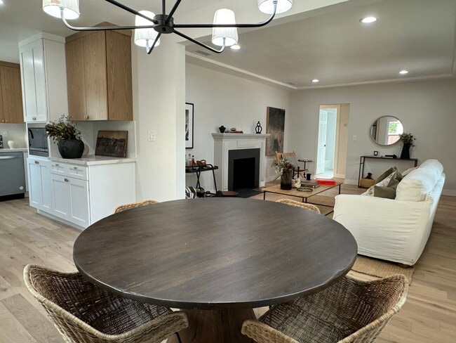 Dinning Room / Kitchen with brand new stainless steel appliances to the left and living room to the - 5950 Simpson Ave