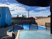 pool with solar cover on - 2619 W 176th St