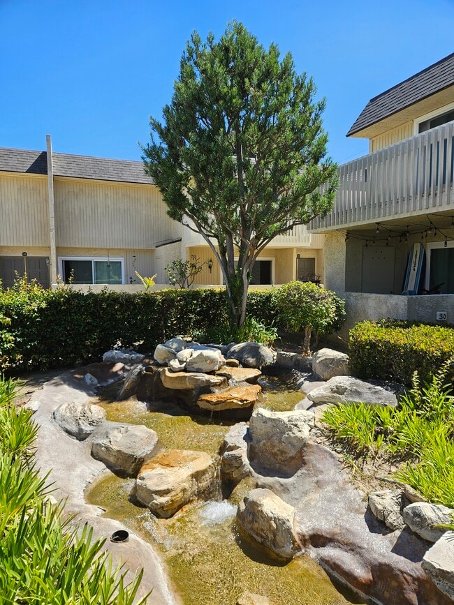 Courtyard stream source - 1200 Opal St Unit Peppertree Village Condo