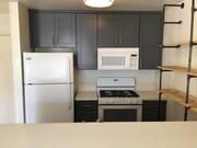 Kitchen with all fridge, over-the-range microwave, gas stovetop range and oven - 3601 Hughes Ave