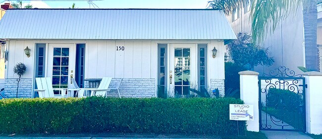 Building with gate - 150 Pomona Ave Unit #4