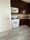 Kitchen stove and granite countertops - 1156 N Chicago St Unit 4