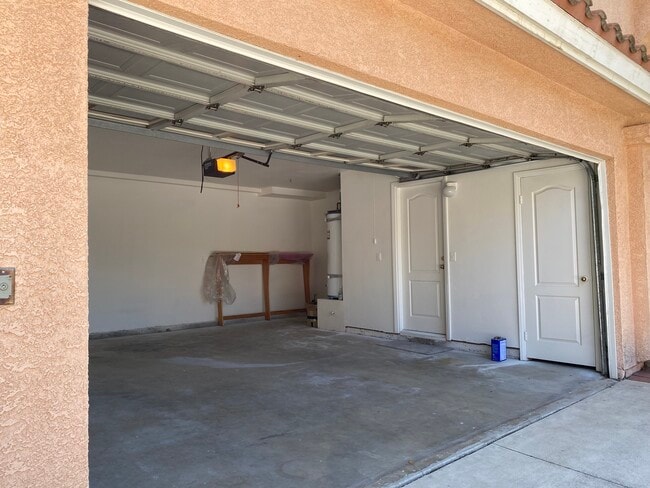 2-Car Garage with entrances to storage room and kitchen - 915 W Arrow Hwy Unit 5