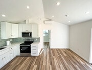 Kitchen + Living Space looking into bedroom - 166 Comstock Dr