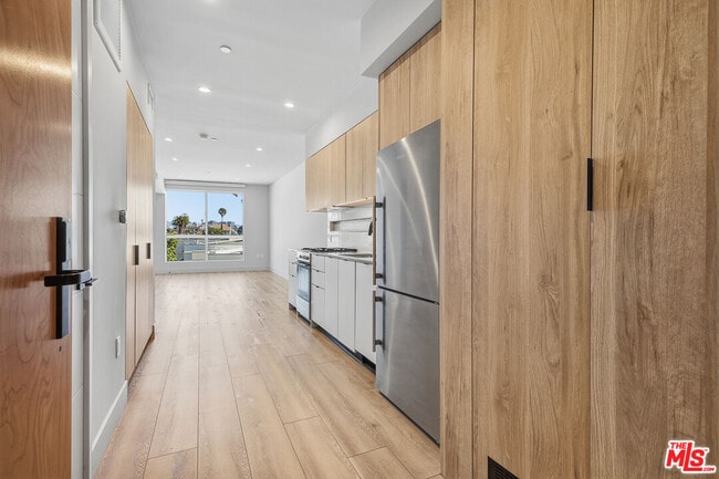 Building Photo - 12431 Rochester Ave Unit 410