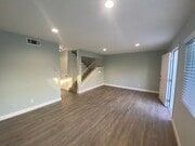 Spacious, sunny living room - 3916 W 178th St Apartments Unit #2