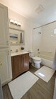 Beach style bathroom - 4379 Maryland St Apartments Unit 4379