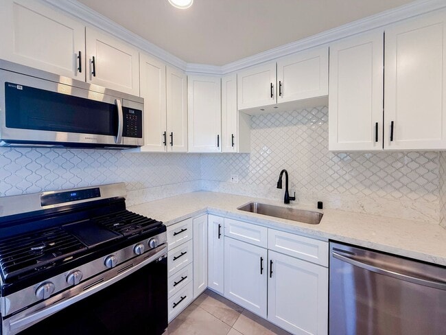 Photo - Renovated Triplex with Private Yard, AC, and Parking