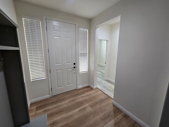 Photo - Open-Concept Living with Downstairs Bedroom & Enclosed Patio Retreat