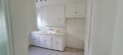 Kitchen from dining room - 11683 Chandler Blvd Apartments