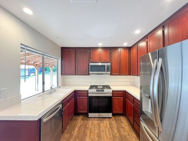 Photo - Charming 3B/2BA Home in Bay Terraces W/ W/D, A/C, Fireplace, Covered Patio, and Large Backyard!