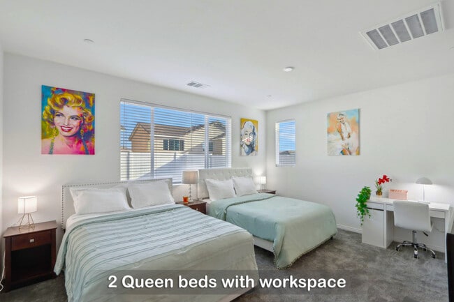 Two queen beds with a dedicated workspace for your convenience. - 30153 Truckee Cir