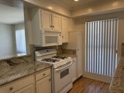 Apt #5: Kitchen includes oven, stove, and microwave - 321 E Dryden St