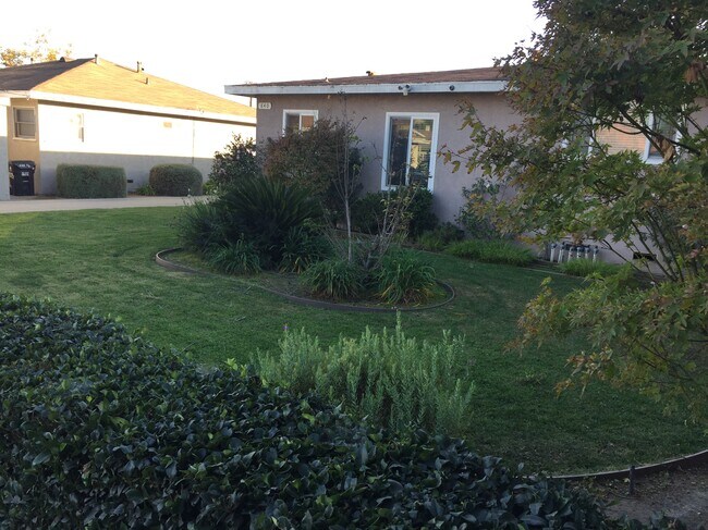 View of landscaping at front of property. - 840 W 168th St Unit #B